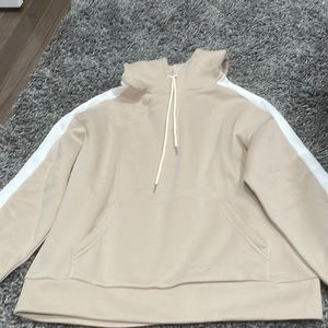 Tan supersoft and comfy sweatshirt with white stripe along the sleeves